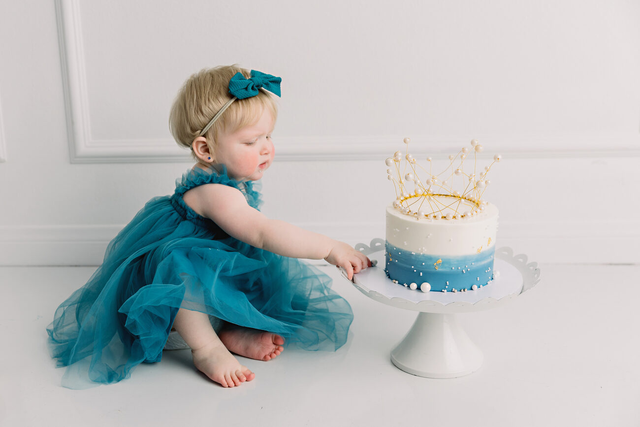 First birthday cake smash with baby girl in teal tulle dress, Boise baby photographer